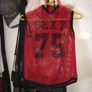 Crop top shirt. Written “sexy 75”